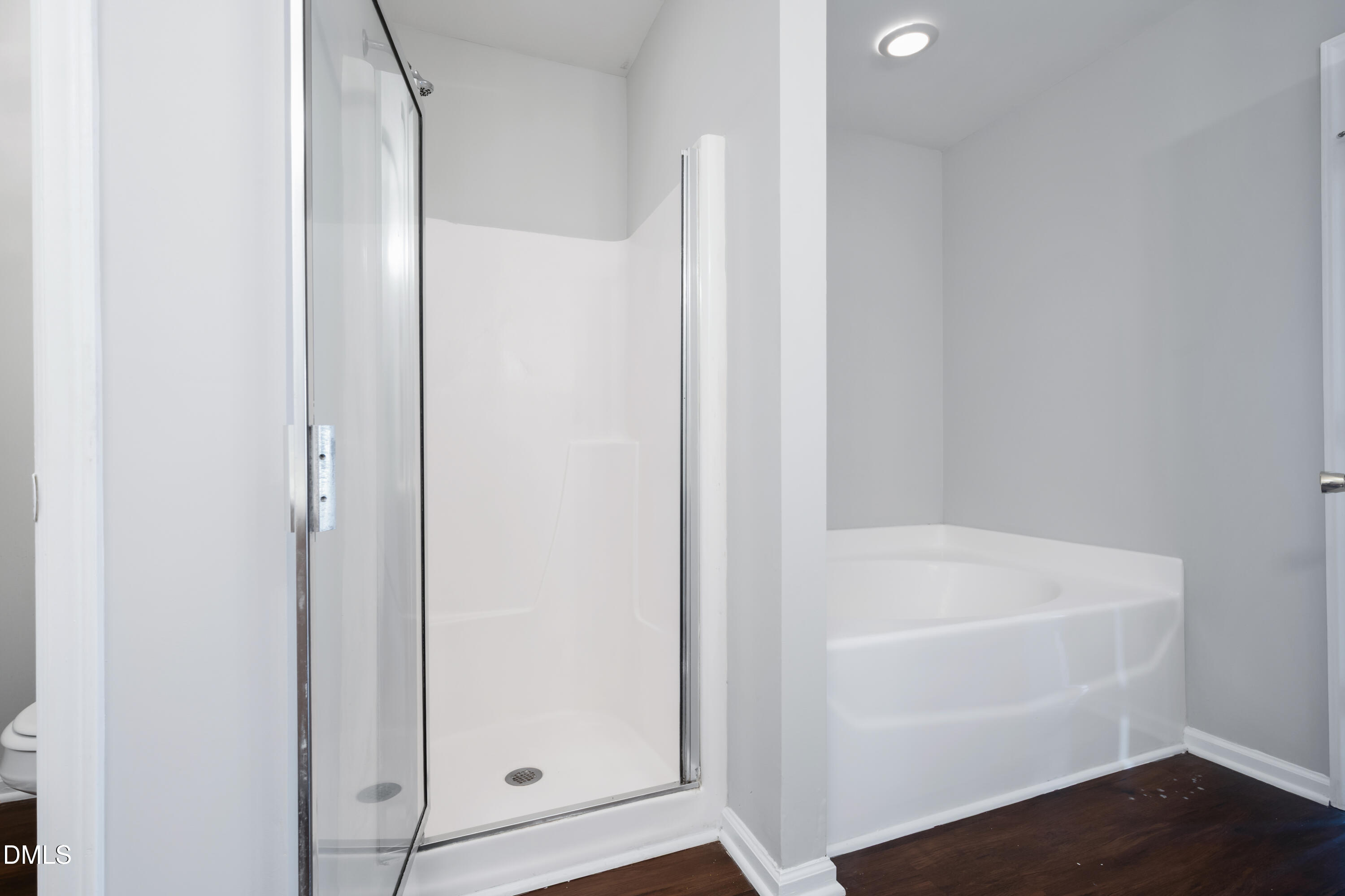 1532 Pebble Ridge Drive Raleigh, NC 27610 - Photo 30 of 40 a white bath tub sitting next to a white sink