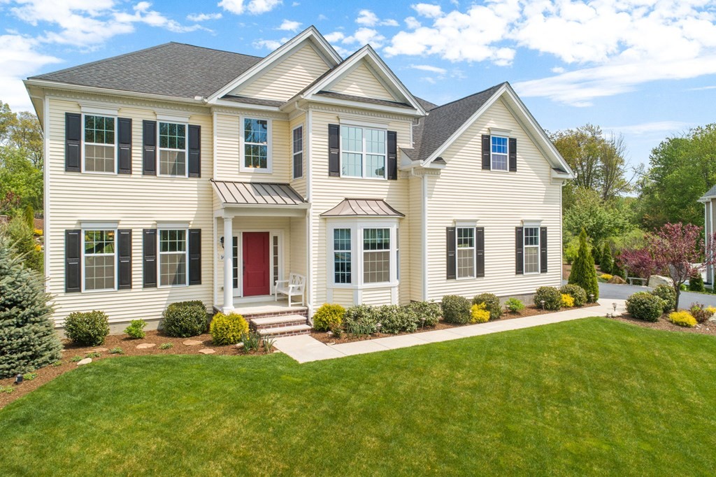 a front view of a house with a yard