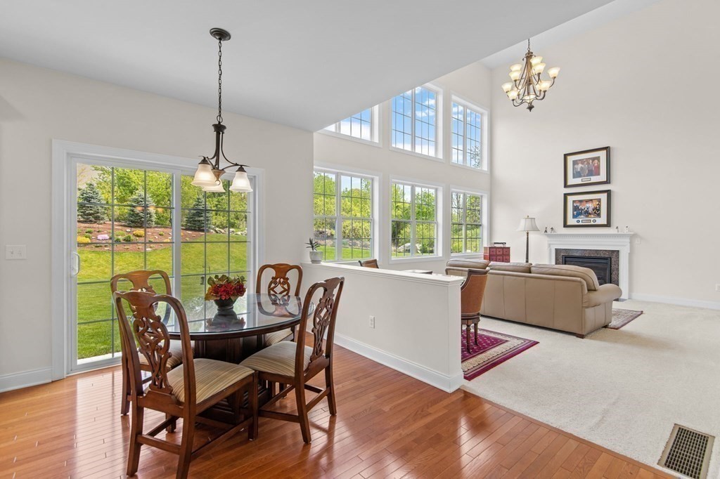 14 Pine Tree Drive Methuen, MA 01844 - Photo 12 of 42 a view of a dining room with furniture a chandelier and wooden floor