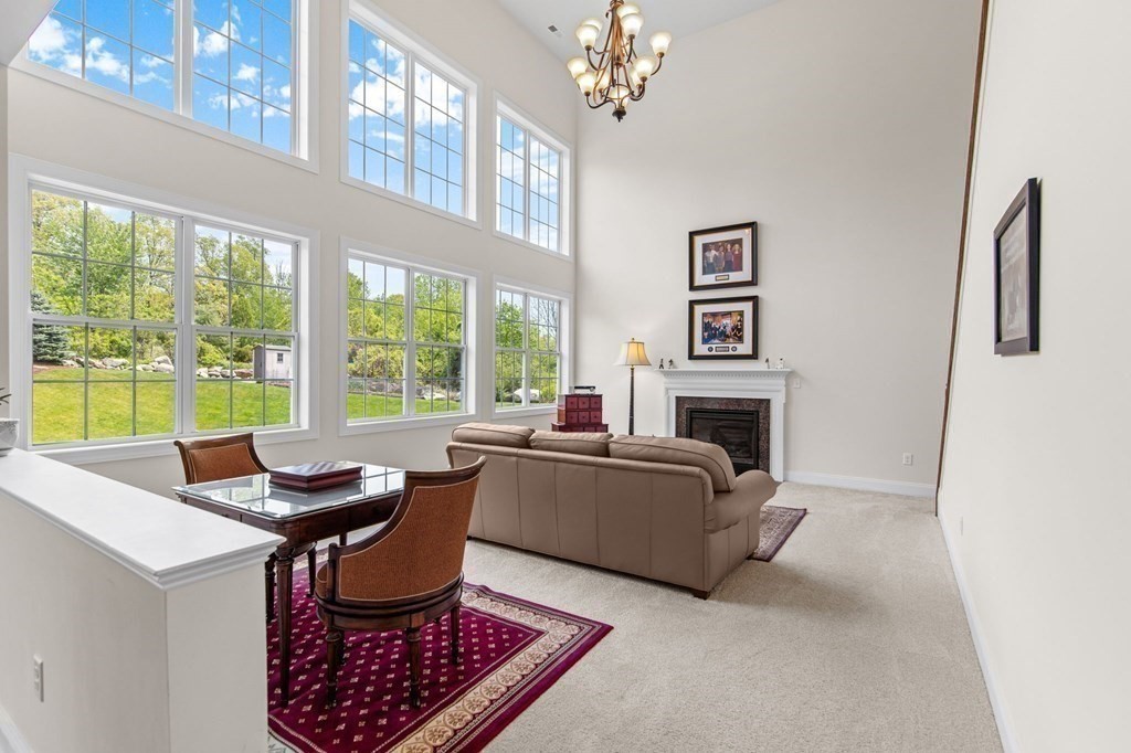 14 Pine Tree Drive Methuen, MA 01844 - Photo 16 of 42 a living room with furniture and a fireplace