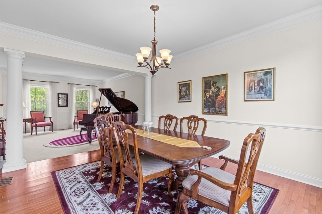 14 Pine Tree Drive Methuen, MA 01844 - Photo 21 of 42 a dining room with furniture a rug and wooden floor
