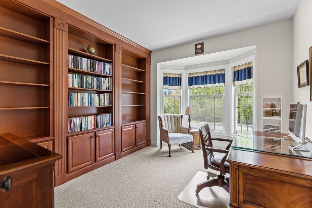14 Pine Tree Drive Methuen, MA 01844 - Photo 23 of 42 a living room with furniture and a book shelf