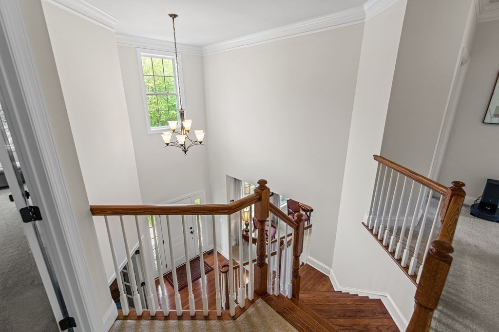 14 Pine Tree Drive Methuen, MA 01844 - Photo 26 of 42 a view of a hallway with wooden floor and stairs