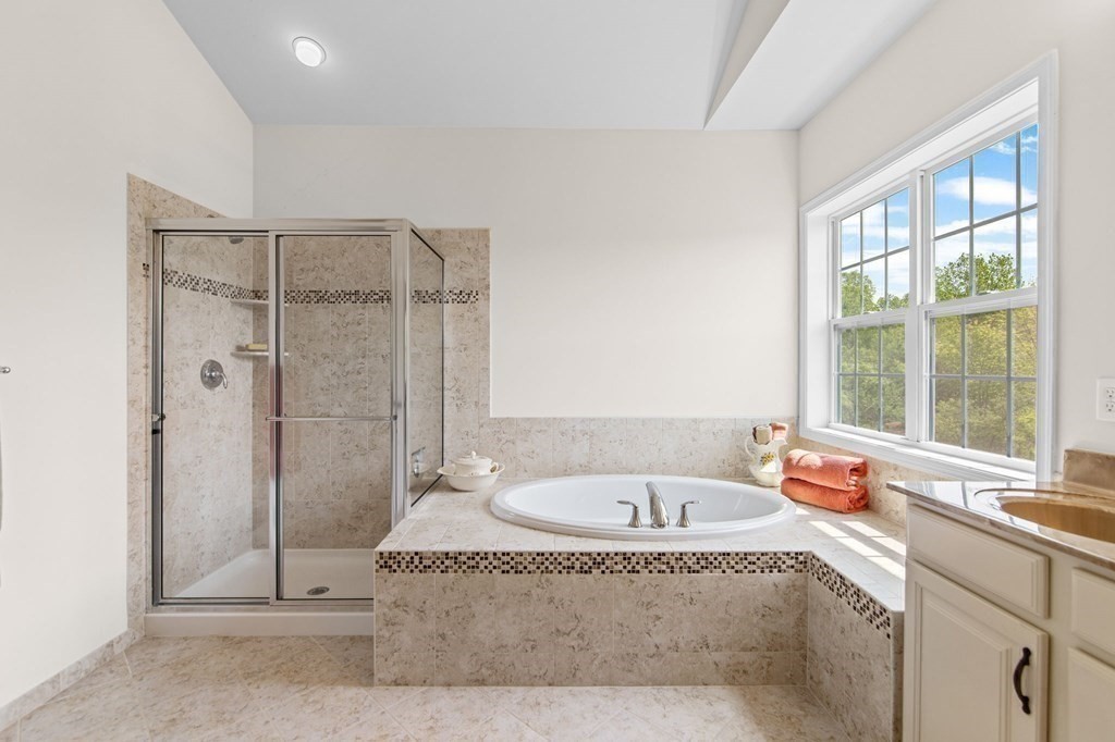 14 Pine Tree Drive Methuen, MA 01844 - Photo 30 of 42 a bathroom with a granite countertop bathtub and shower