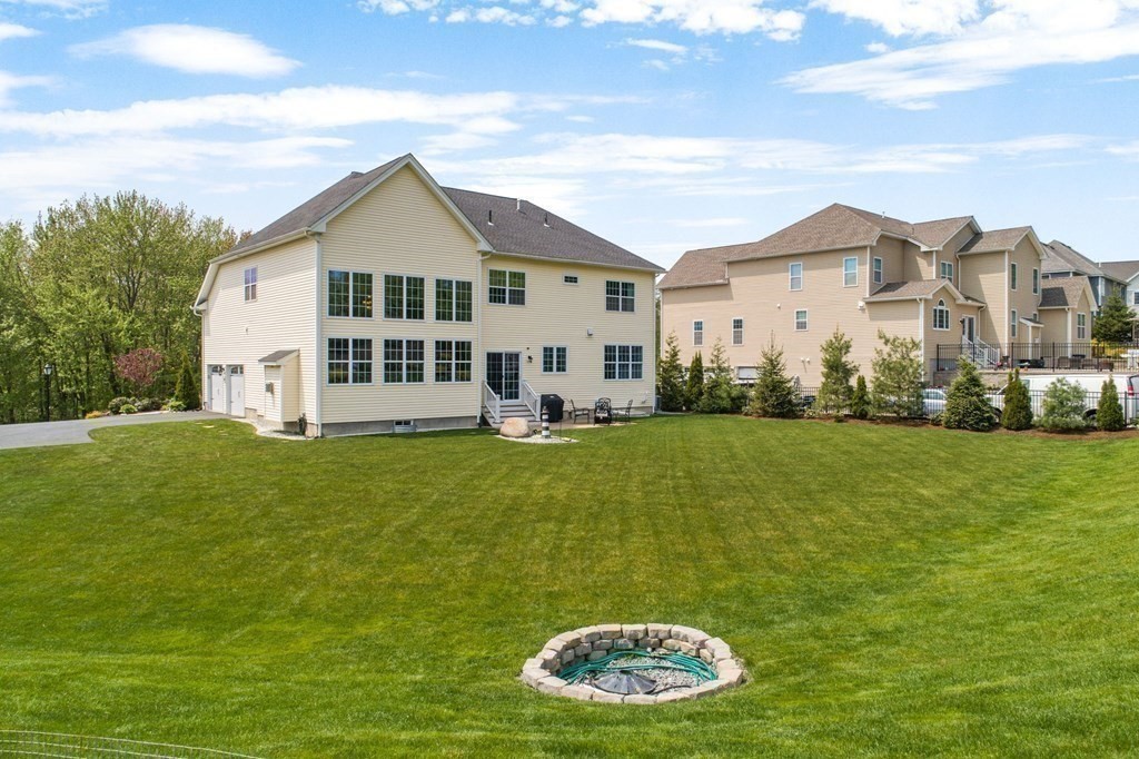 14 Pine Tree Drive Methuen, MA 01844 - Photo 3 of 42 a view of a white house with a big yard and potted plants