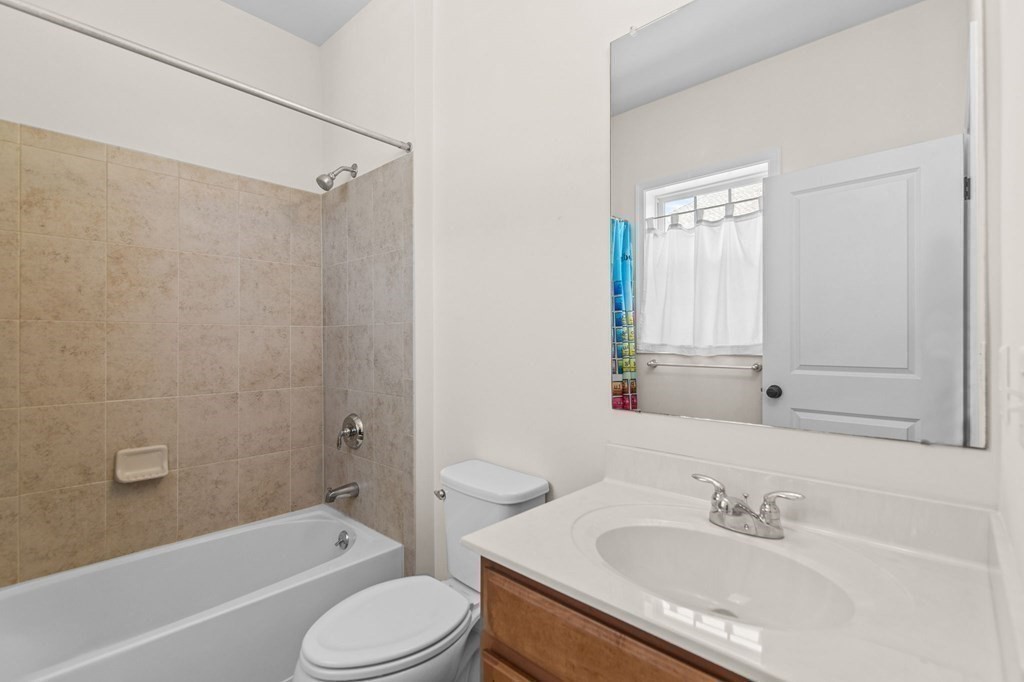 14 Pine Tree Drive Methuen, MA 01844 - Photo 32 of 42 a bathroom with a granite countertop sink toilet and shower