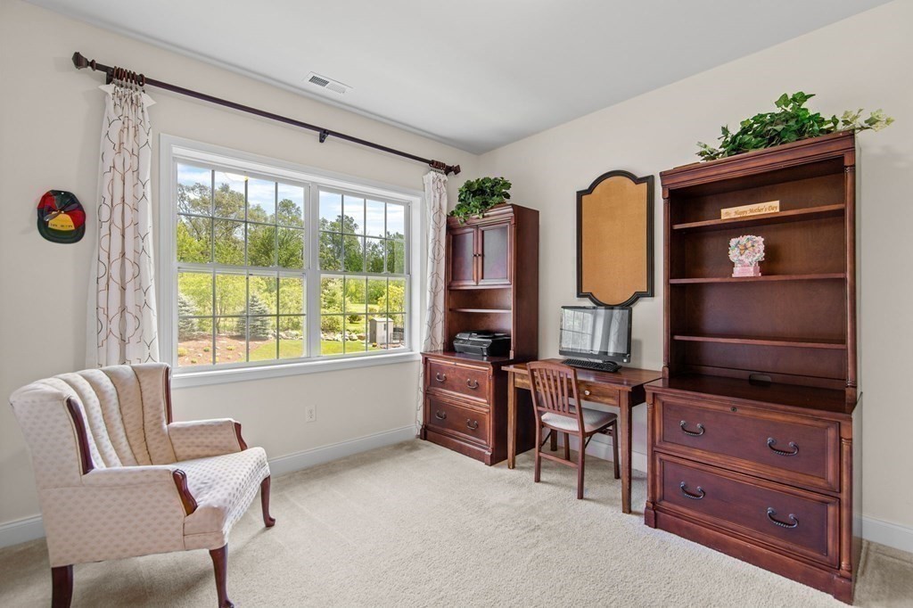 14 Pine Tree Drive Methuen, MA 01844 - Photo 35 of 42 a living room with furniture and a flat screen tv