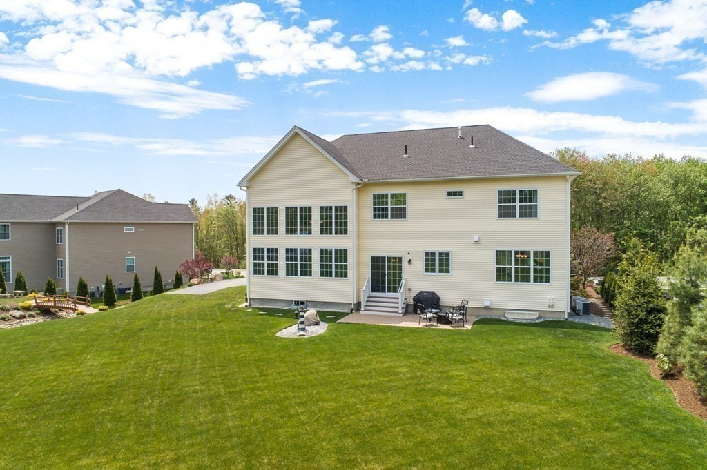 14 Pine Tree Drive Methuen, MA 01844 - Photo 37 of 42 a front view of a house with a yard porch and outdoor seating