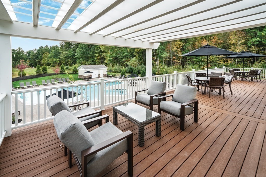 14 Pine Tree Drive Methuen, MA 01844 - Photo 39 of 42 a balcony with wooden floor outdoor seating and city view
