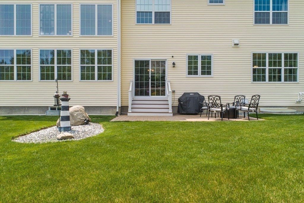 14 Pine Tree Drive Methuen, MA 01844 - Photo 4 of 42 a front view of a house with a yard