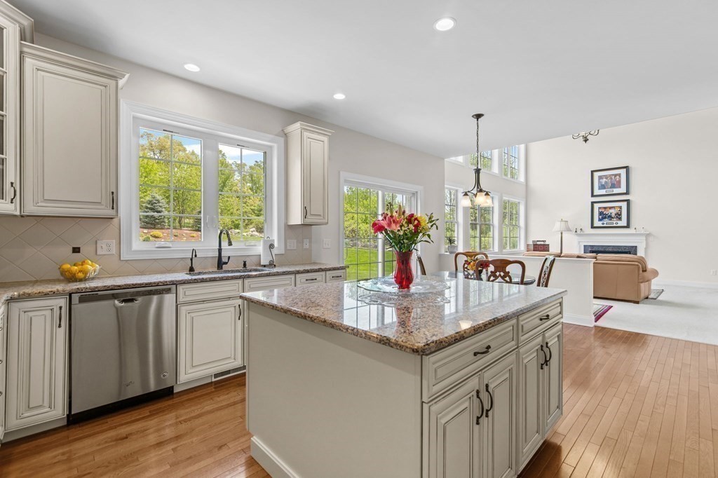 14 Pine Tree Drive Methuen, MA 01844 - Photo 7 of 42 a kitchen with stainless steel appliances granite countertop a sink a stove and wooden floor