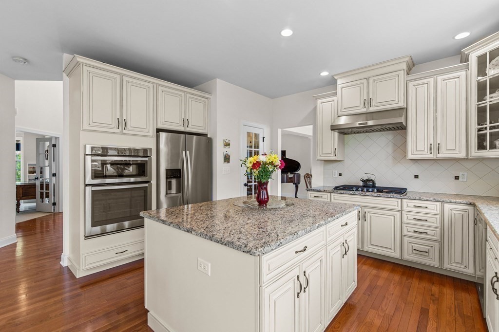 14 Pine Tree Drive Methuen, MA 01844 - Photo 8 of 42 a kitchen with stainless steel appliances granite countertop a sink stove and refrigerator