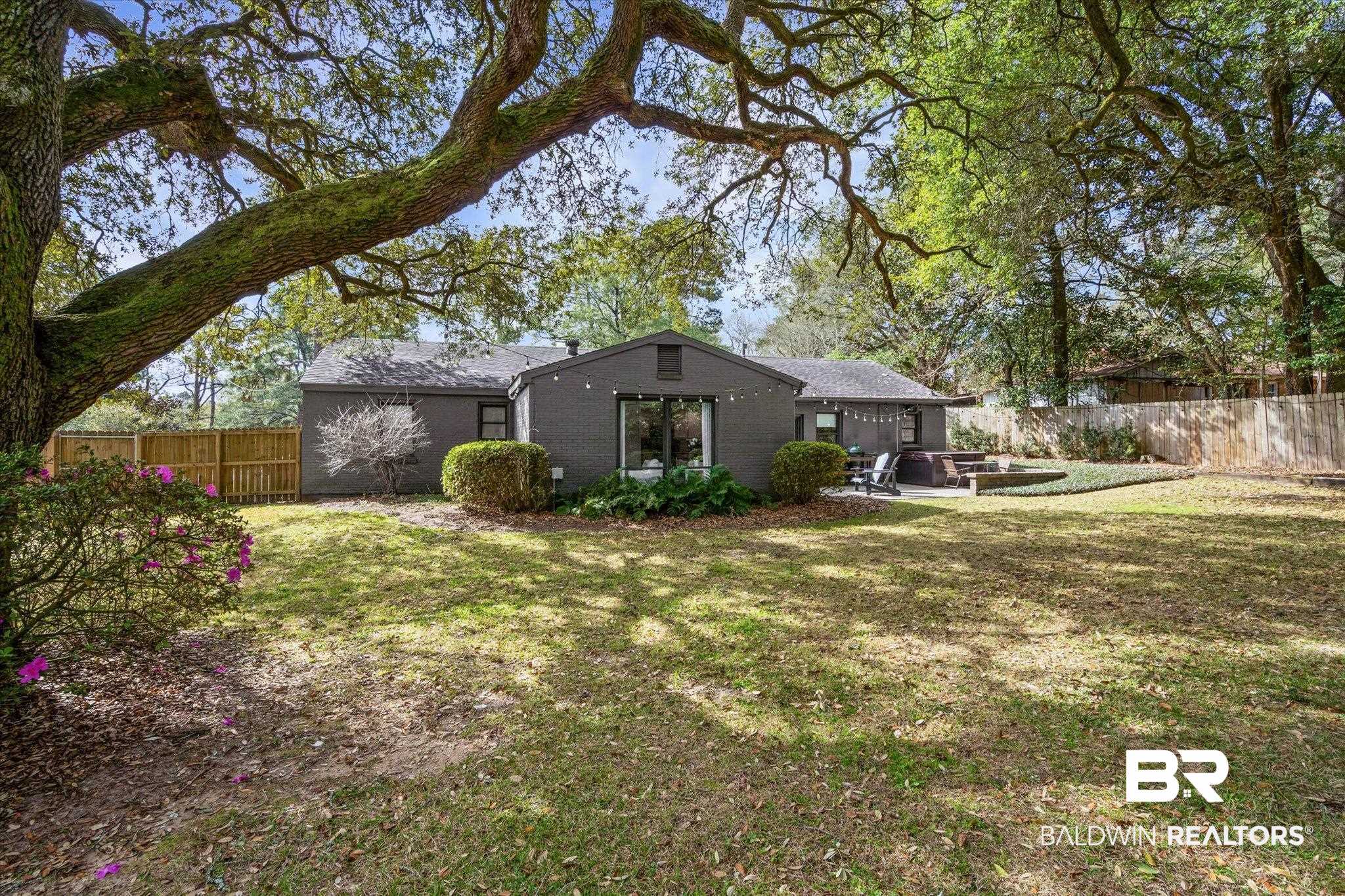 4590 Sunset Drive North Mobile, AL 36608 - Photo 29 of 35 Fenced backyard with a patio area