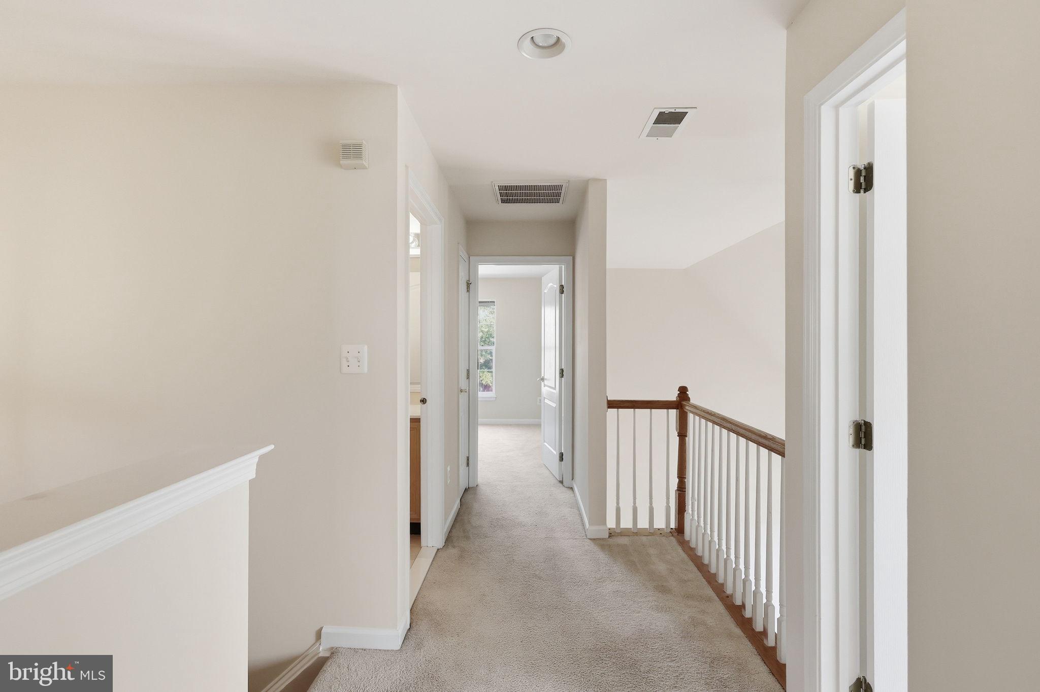 19617 Edgemont Square Ashburn, VA 20147 - Photo 32 of 65 a view of a hallway with wooden floor and entryway