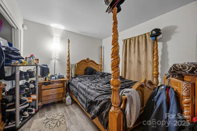 a bedroom with a bed and a closet