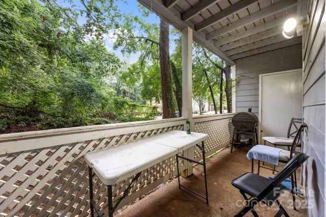 a view of a two chairs in the balcony