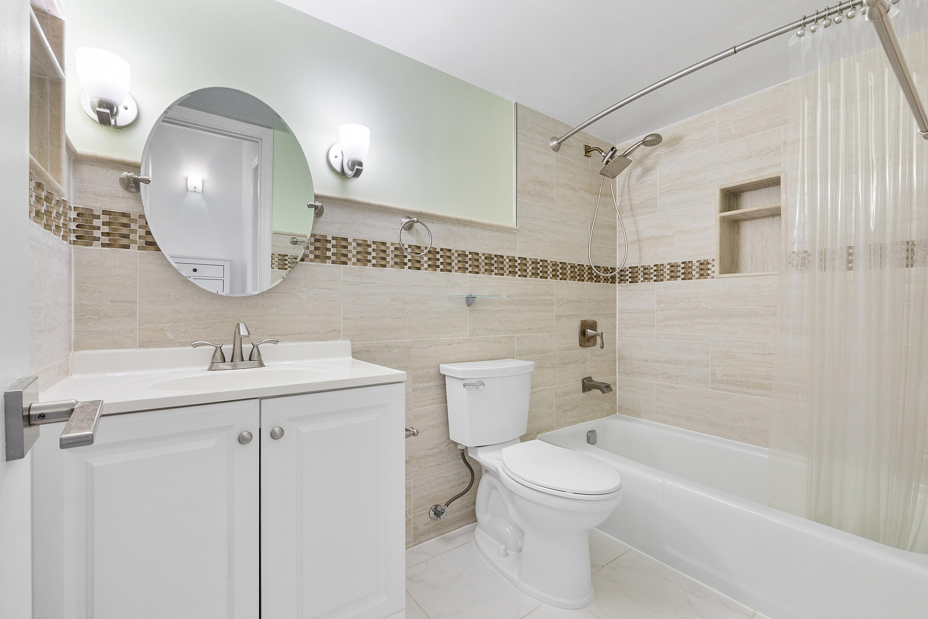 1100 Northwest 13th Street, Unit 192D Boca Raton, FL 33486 - Photo 19 of 42 a bathroom with a toilet sink and mirror