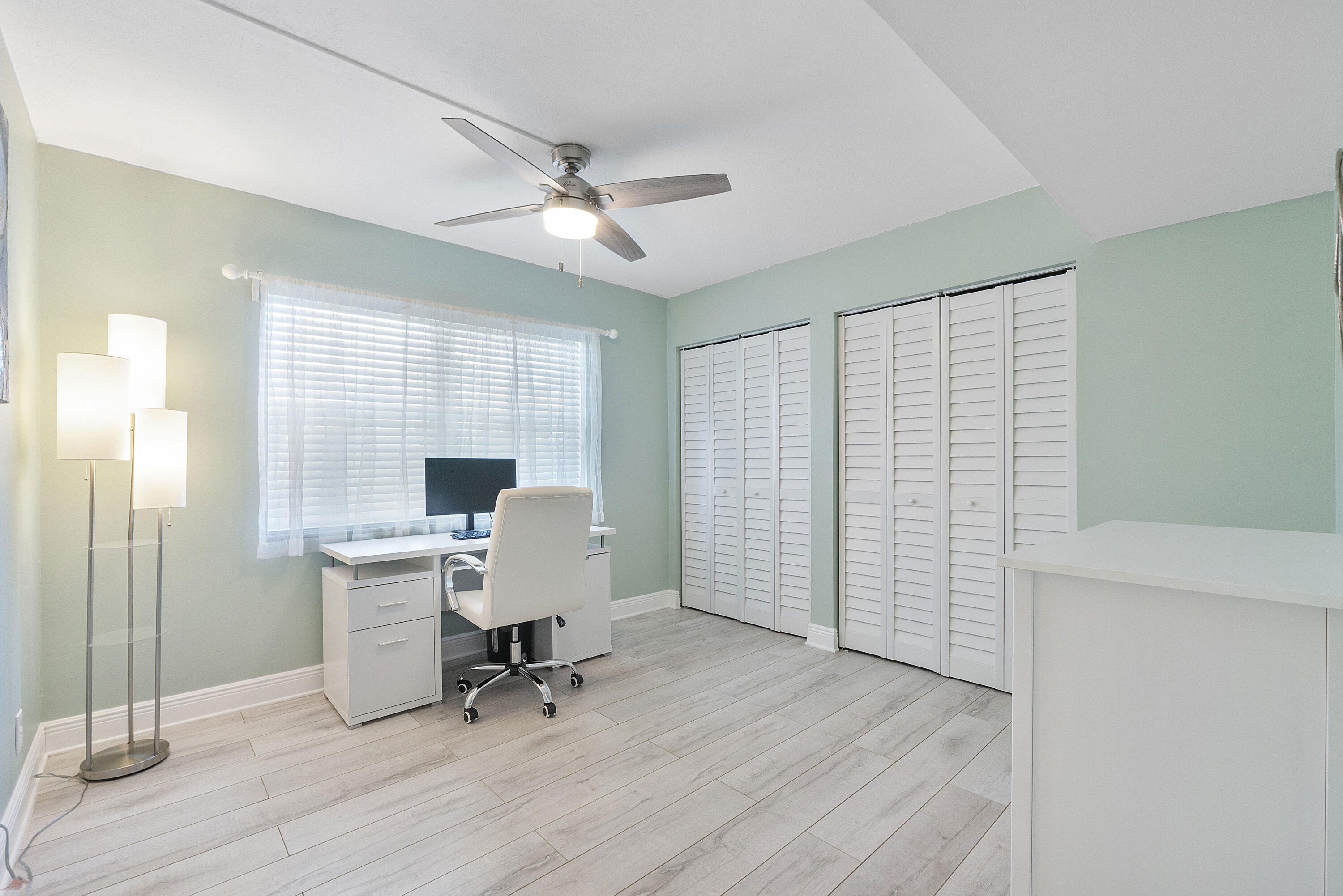1100 Northwest 13th Street, Unit 192D Boca Raton, FL 33486 - Photo 21 of 42 a view of a workspace with furniture and a window