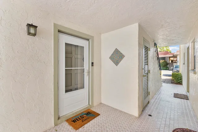 a front view of a house with a garage