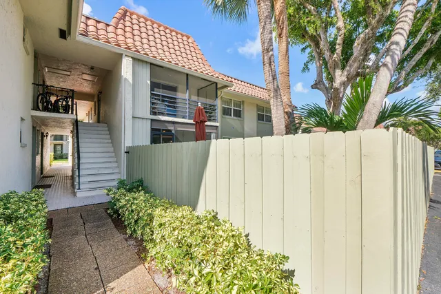 a view of a car parked in front of a house