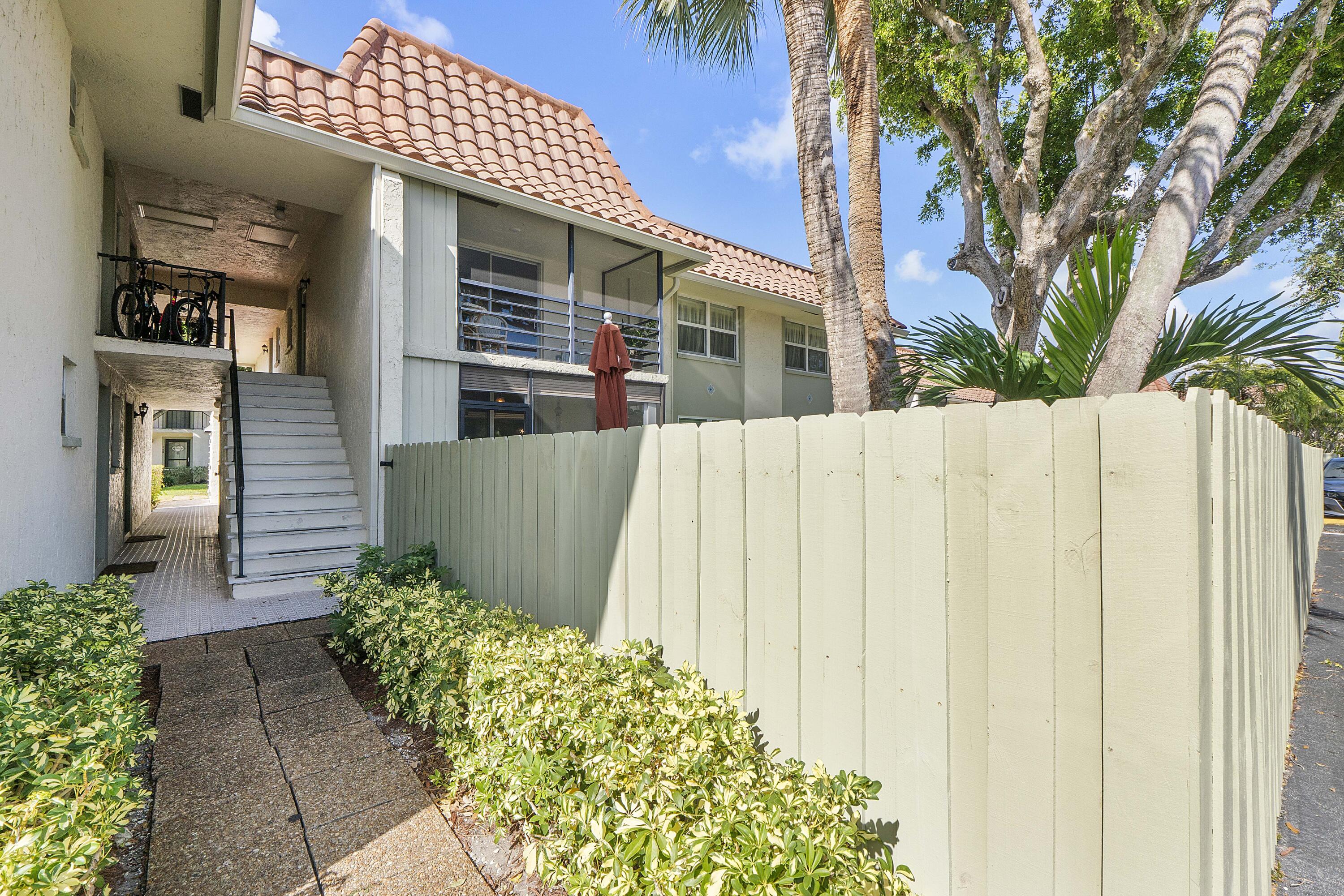 1100 Northwest 13th Street, Unit 192D Boca Raton, FL 33486 - Photo 31 of 42 a front view of a house with a garage