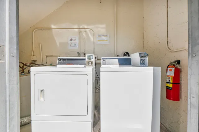 a view of a house with pool and sitting area