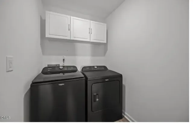 a view of storage and utility room with washer and dryer