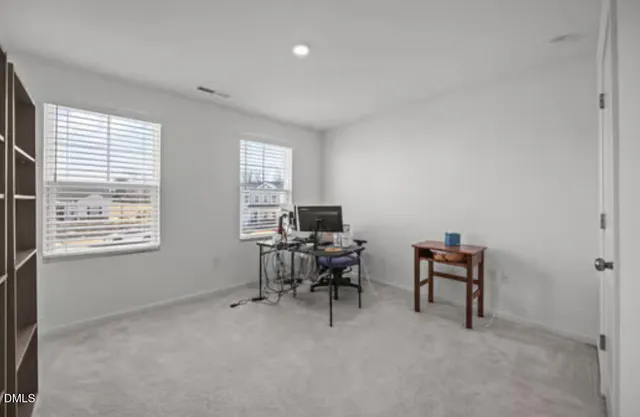 a workspace with furniture and a window