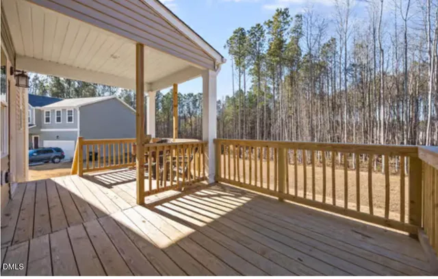 a view of a balcony with wooden floor