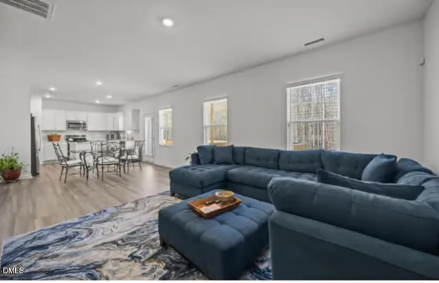 a living room with furniture and a table