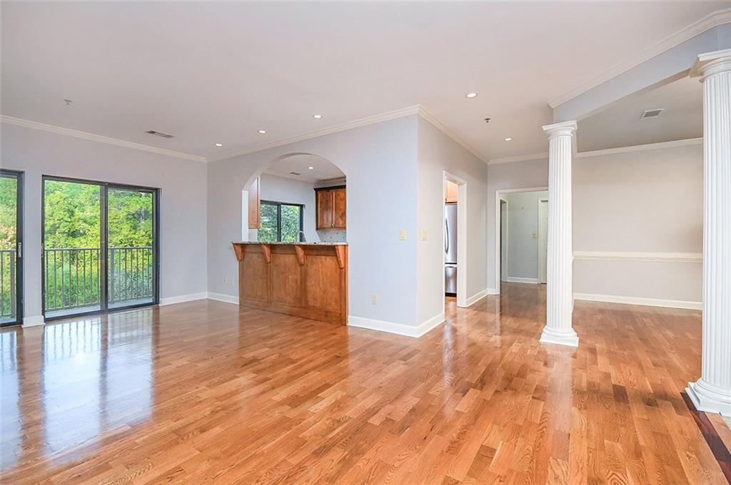 2865 Lenox Road Northeast, Unit 407 Atlanta, GA 30324 - Photo 8 of 27 a view of a big room with wooden floor and windows