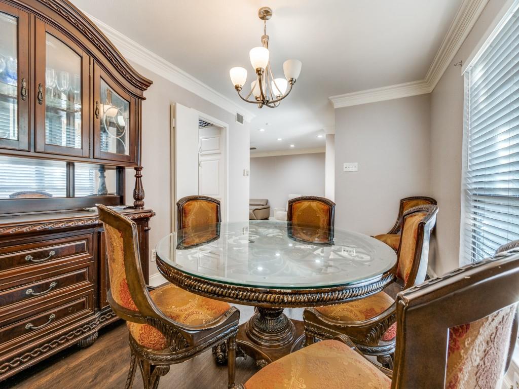 9250 Flickering Shadow Drive Dallas, TX 75243 - Photo 12 of 25 a dining room with furniture and chandelier