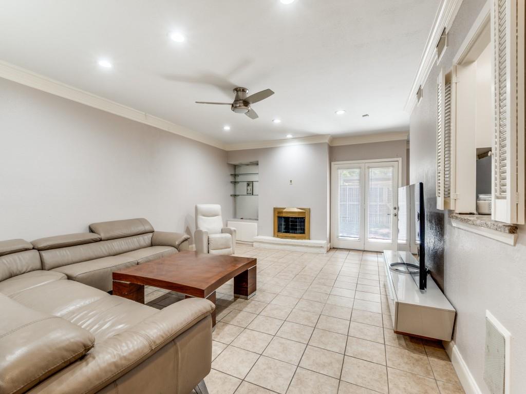 9250 Flickering Shadow Drive Dallas, TX 75243 - Photo 2 of 25 a living room with furniture and a fireplace