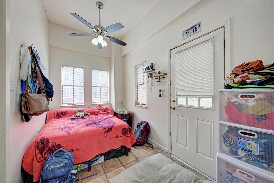 712 Graham Place, Unit 101 Austin, TX 78705 - Photo 15 of 19 Bedroom featuring a ceiling fan