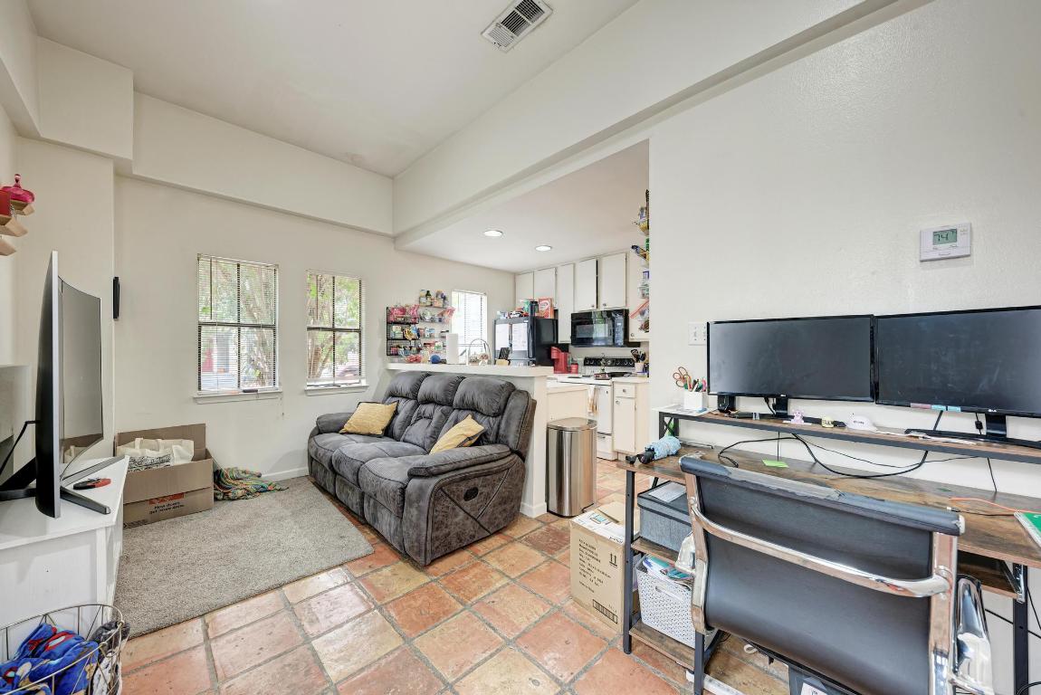 712 Graham Place, Unit 101 Austin, TX 78705 - Photo 7 of 19 Living room featuring an office area