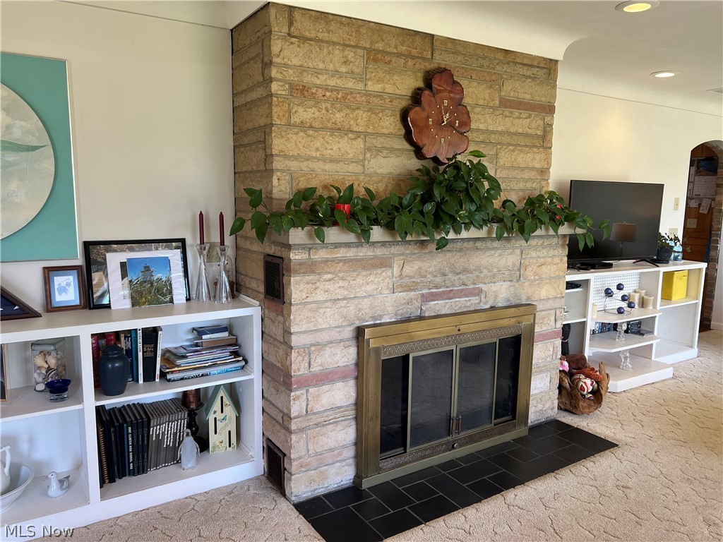 4663 East Harbor Road Port Clinton, OH 43452 - Photo 7 of 31 Carpeted living room featuring a fireplace