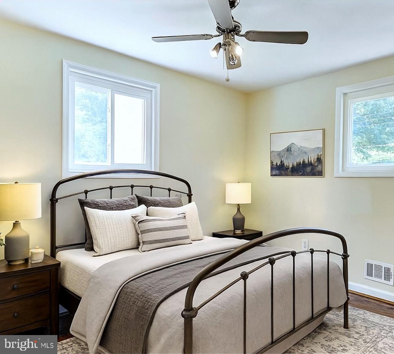 5900 Aley Road Temple Hills, MD 20748 - Photo 2 of 4 a bedroom with a large bed and a chandelier