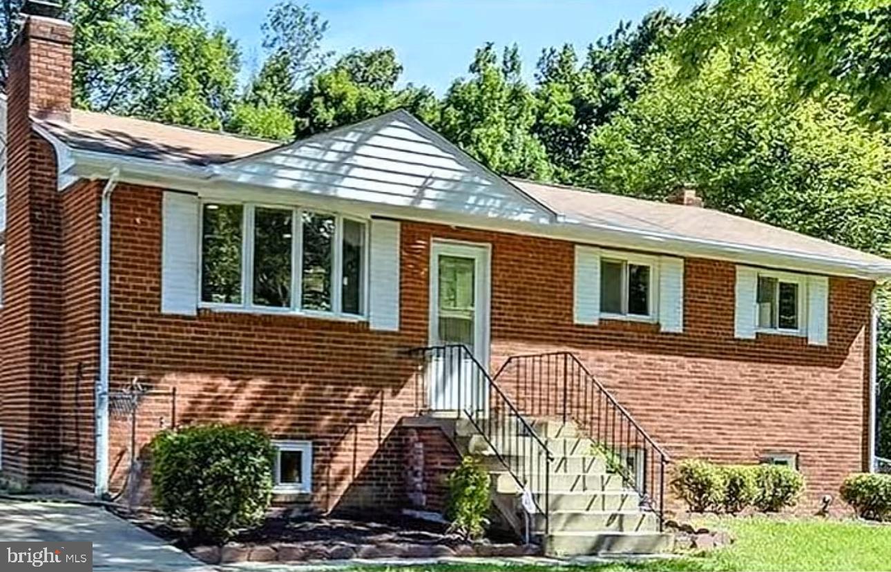 5900 Aley Road Temple Hills, MD 20748 - Photo 4 of 4 a front view of a house with garden