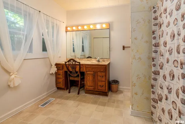 a view of a room with a balcony and wooden floor