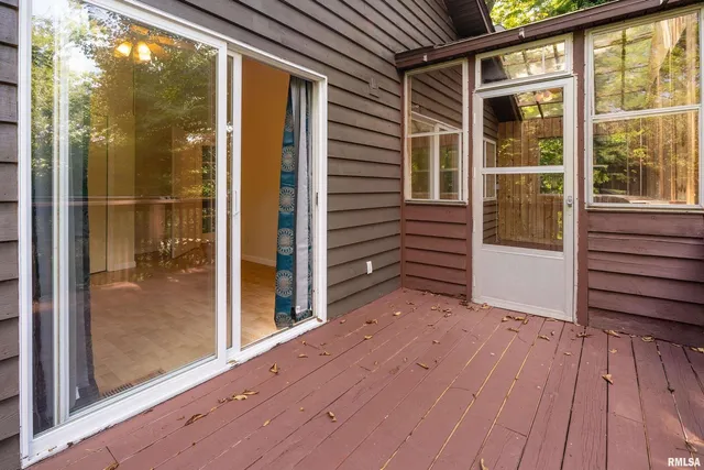 a view of a balcony with wooden floor