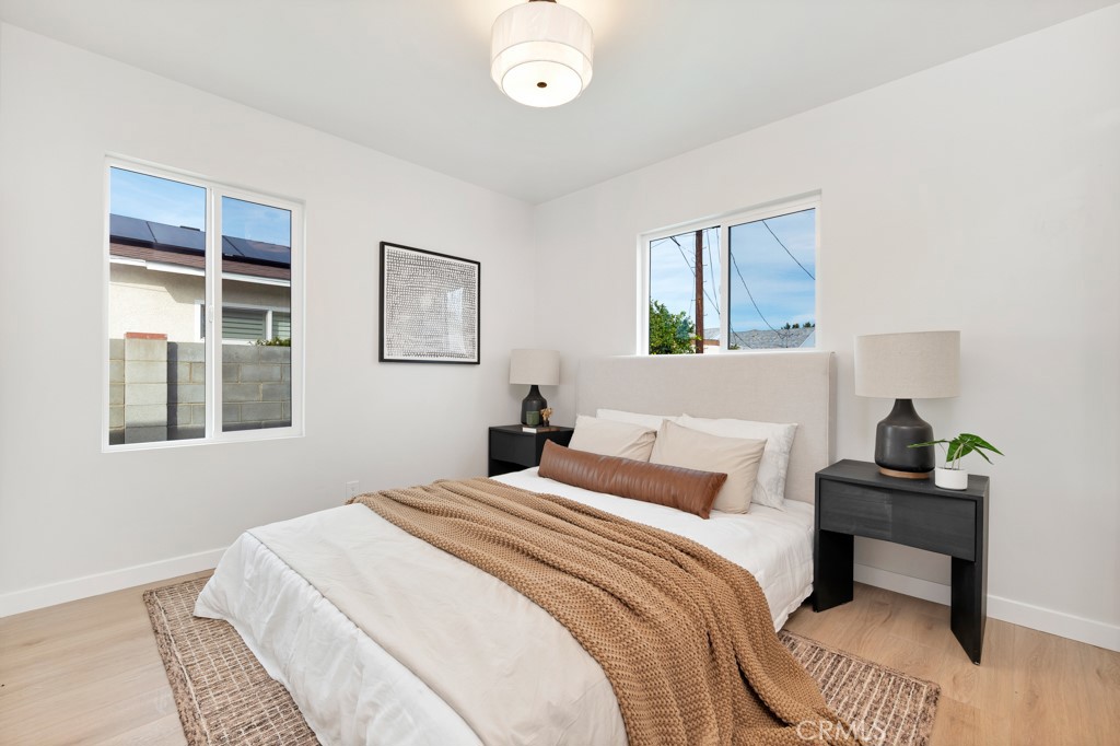 6644 Bothwell Road Reseda, CA 91335 - Photo 15 of 29 a bedroom with a bed and a window