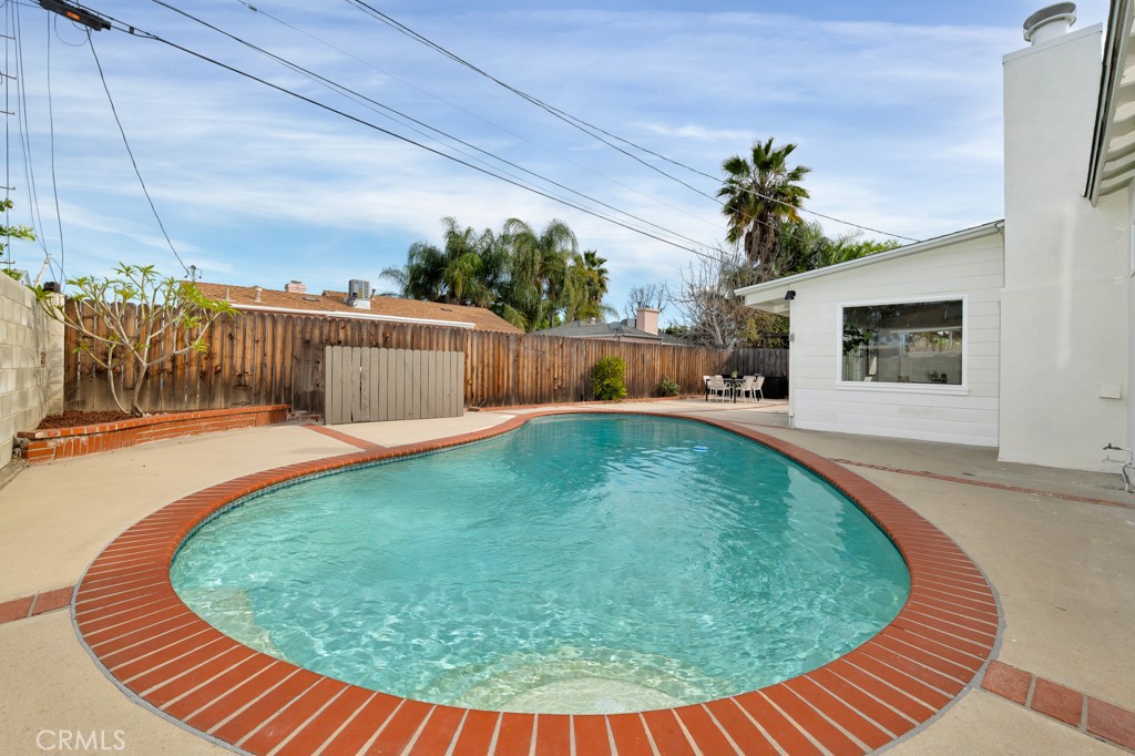 6644 Bothwell Road Reseda, CA 91335 - Photo 23 of 29 a view of a swimming pool with a patio