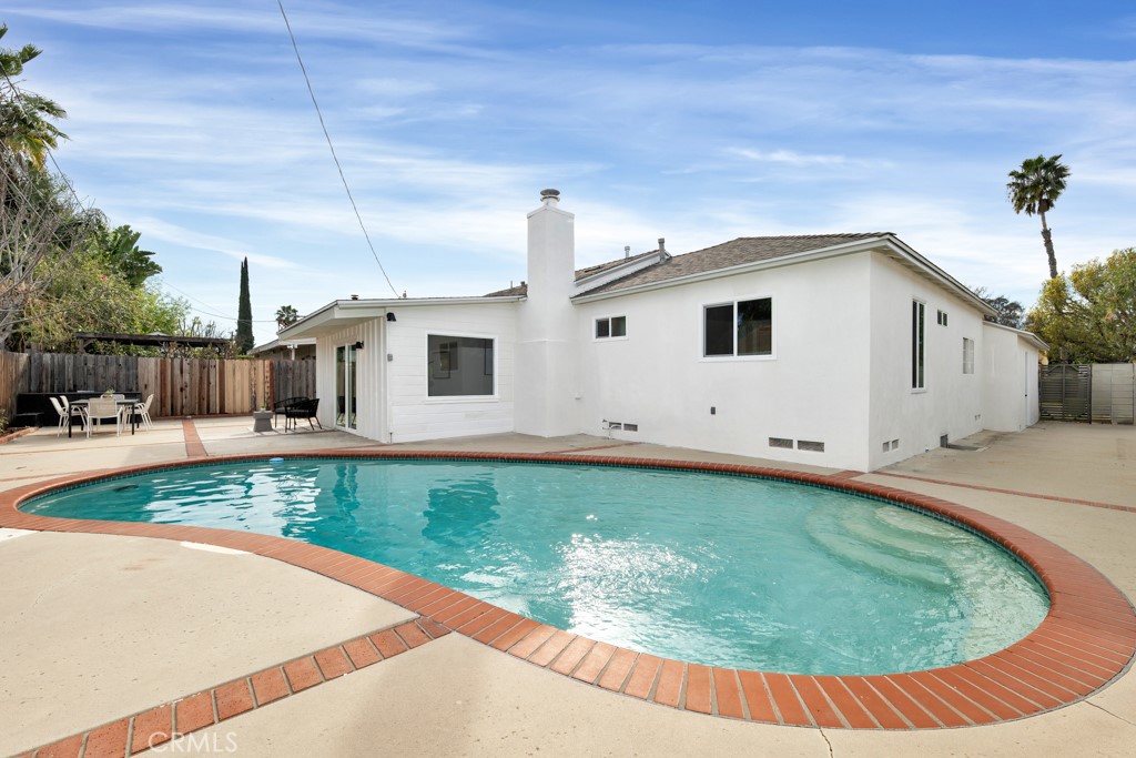 6644 Bothwell Road Reseda, CA 91335 - Photo 24 of 29 a view of a house with a swimming pool