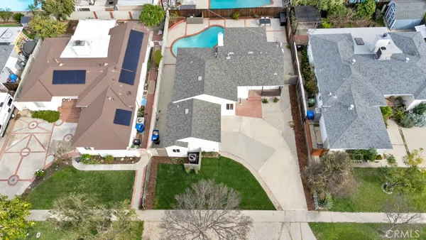 an aerial view of a house with a swimming pool