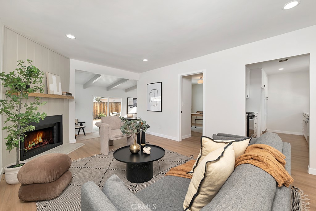 6644 Bothwell Road Reseda, CA 91335 - Photo 5 of 29 a living room with furniture and a fireplace