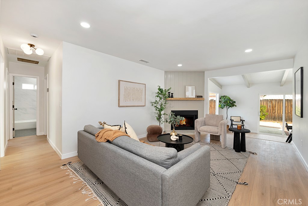 6644 Bothwell Road Reseda, CA 91335 - Photo 6 of 29 a living room with furniture and a fireplace