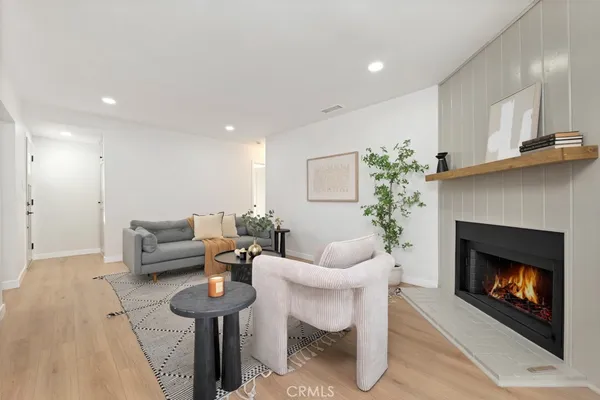 a kitchen with stainless steel appliances a sink dishwasher stove and oven with cabinets