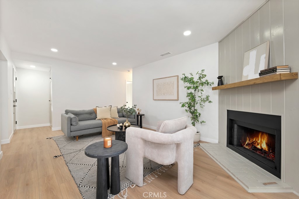 6644 Bothwell Road Reseda, CA 91335 - Photo 7 of 29 a living room with furniture and a fireplace