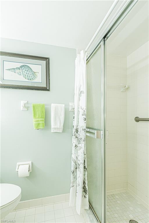 1 High Point Circle West, Unit 102 Naples, FL 34103 - Photo 18 of 35 a bathroom with a shower and a toilet