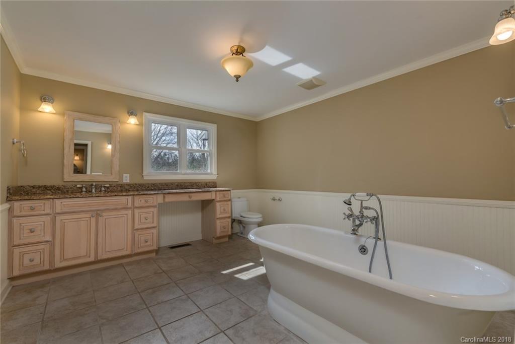 9990 New Cut Road Campobello, SC 29322 - Photo 14 of 31 a bathroom with a sink a toilet and bathtub
